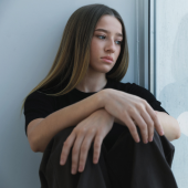 Teenage girl at window