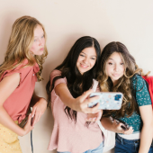 teen girls taking a selfie